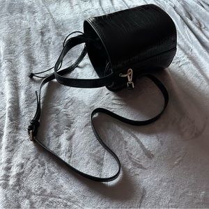Black Lulu faux croc and faux suede bucket bag with optional shoulder strap